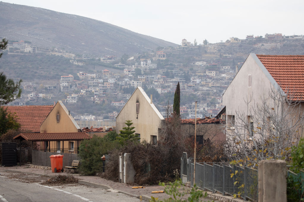 METULA, ISRAEL - DECEMBER 4: Houses which were damaged by Hezbollah rocket strikes are seen in the northern town with the Lebanese village of Al Adisa seen In the background on December 4, 2024 in Metula, Israel. Ten people were killed in Israeli airstrikes in Southern Lebanon overnight and Hezbollah had earlier fired two mortars at an Israeli army base, but the US and France have said the ceasefire is largely holding despite the violence. (Photo by Amir Levy/Getty Images)