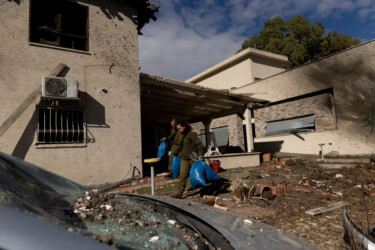 KIRYAT SHMONA, ISRAEL - NOVEMBER 26: Soldiers carry out objects after a house was struck by a rocket fired from Lebanon on November 26, 2024 in Kiryat Shmona, Israel. Israel's cabinet is discussing a proposed 60-day ceasefire deal with Hezbollah, the Lebanese militant group whom Israel launched a ground invasion against almost two months ago, after trading cross-border fire since early October 2023. (Photo by Amir Levy/Getty Images)