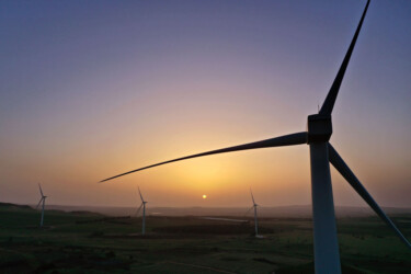 EL ROM, GOLAN HEIGHTS - MAY 19: A sunrise aerial view of new wind turbines constructed between vineyards and fruit orchards as part of the Valley of Tears (Emek Habacha) wind turbines farm project on May 19, 2020 near Kibbutz El Rom in Israel's Golan Heights. The project is a joint venture of the Israeli company Enlight Renewable Energy Ltd which deals in solar and wind energy in Israel and Europe, Aveeram and Dr. Eli Ben Dov. The 34 General Electric turbines, which will generate a total installed capacity of 108 GW of sustainable energy, are sited on agricultural land of nearby five kibbutz farming communities and agricultural activity will continue concurrently with the operation of the turbines. The turbine's hub height is about 86 meters above ground level, its three blades are 51.5 meters long and weigh some 17 metric tons each. The project is expected to come online in 2021 and at full capacity will supply environmentally friendly electricity to some 40,000 households in Israel, thereby reducing air pollution in Israel nearly 200,000 tons of carbon dioxide a year. (Photo by David Silverman/Getty Images)