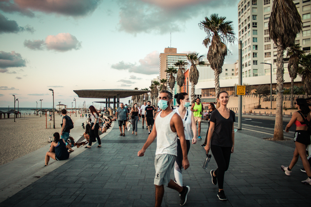 Tel Aviv Israel October 04, 2020 View of unidentified people without a face mask to protect themself walking on Herbert Samuel Promenade in Tel Aviv during lockdown and Coronavirus outbreak