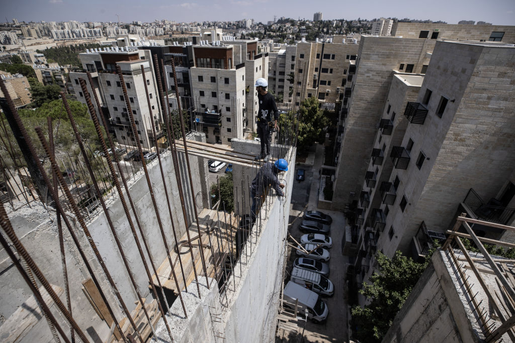 JERUSALEM - AUGUST 29: Intensive construction works being carried out on older buildings in the Ramat Eshkol neighborhood of West Jerusalem on August 29, 2024. In Israel, recent building regulations mandate that all new constructions include shelters, resulting in every new building and apartment being equipped with them. However, older buildings constructed before this regulation lack shelters. In response to the ongoing attacks on Gaza since October 7 and escalating tensions with Iran and Hezbollah, shelters are now being retrofitted into these older structures. (Photo by Mostafa Alkharouf/Anadolu via Getty Images)