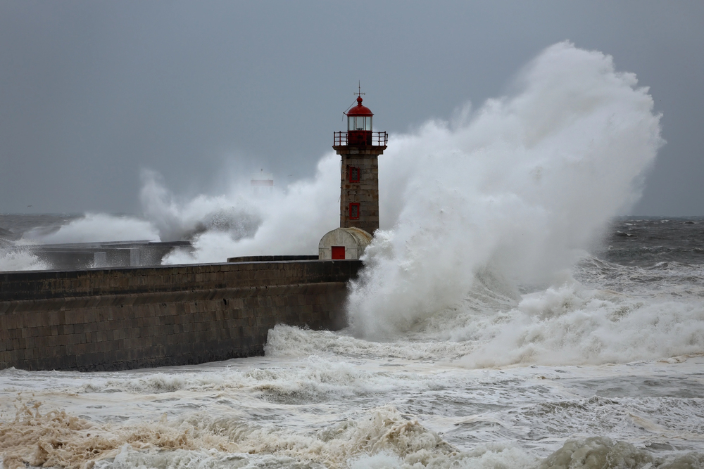 Stormy wave over lighthouses